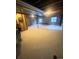 Spacious unfinished basement with concrete floor and two windows, offering potential for customization at 12742 Clermont St, Thornton, CO 80241