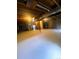Unfinished basement with exposed wood beams, concrete floor, and visible ductwork at 12742 Clermont St, Thornton, CO 80241