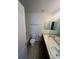 Bathroom features double sinks, tile floors, and a combined shower and tub unit at 12742 Clermont St, Thornton, CO 80241