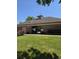 The community center features a red brick exterior with a grassy lawn and well-maintained landscaping at 12742 Clermont St, Thornton, CO 80241