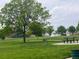 Well-maintained community park with lush green grass, picnic tables, and a playground at 12742 Clermont St, Thornton, CO 80241