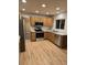 Bright kitchen with stainless steel appliances and light wood cabinets at 12742 Clermont St, Thornton, CO 80241