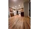 Spacious kitchen with stainless steel appliances, wood cabinetry, hardwood floors, and ample counter space at 12742 Clermont St, Thornton, CO 80241
