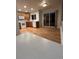 Bright kitchen with modern appliances, wood cabinets, hardwood floors, and sliding glass doors at 12742 Clermont St, Thornton, CO 80241