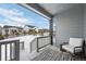 Covered back porch with seating area overlooking backyard at 624 Simmental Loop, Castle Rock, CO 80104