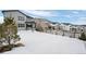 Large backyard with snow covered ground at 624 Simmental Loop, Castle Rock, CO 80104