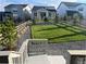 Landscaped backyard with grassy area and gravel at 624 Simmental Loop, Castle Rock, CO 80104