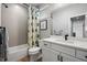 Clean bathroom with a shower/tub combo and modern vanity at 624 Simmental Loop, Castle Rock, CO 80104