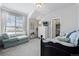Comfortable bedroom with a daybed and window seat at 624 Simmental Loop, Castle Rock, CO 80104
