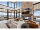 Community room with fireplace, seating areas, and mountain views at 624 Simmental Loop, Castle Rock, CO 80104