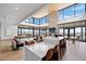Spacious community room with a fireplace, seating, and large windows at 624 Simmental Loop, Castle Rock, CO 80104