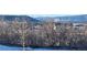 View of homes nestled in a wooded area with mountains in background at 624 Simmental Loop, Castle Rock, CO 80104