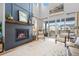 Cozy living room fireplace with a sleek, modern design and expansive windows, providing ample natural light at 624 Simmental Loop, Castle Rock, CO 80104
