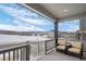 Covered porch with seating area and mountain views at 624 Simmental Loop, Castle Rock, CO 80104