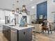 Modern kitchen with stainless steel appliances and an island at 624 Simmental Loop, Castle Rock, CO 80104