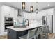 Modern kitchen with stainless steel appliances and white cabinetry at 624 Simmental Loop, Castle Rock, CO 80104