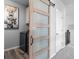 Laundry room with barn door, washer, and dryer at 624 Simmental Loop, Castle Rock, CO 80104