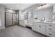 Main bathroom boasts dual vanities and a large walk-in shower at 624 Simmental Loop, Castle Rock, CO 80104