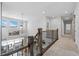Spacious upper hallway with a view of the living room below at 624 Simmental Loop, Castle Rock, CO 80104