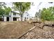 Spacious backyard with a unique landscape design and tiered retaining walls at 3679 S Zeno Way, Aurora, CO 80013