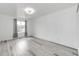 Bright bedroom features a large window with natural light and modern flooring at 3679 S Zeno Way, Aurora, CO 80013