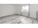 Bright bedroom with natural light, modern floors, and neutral colors, awaiting your personal touch at 3679 S Zeno Way, Aurora, CO 80013