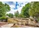Large wooden deck in backyard offers great spot to relax outdoors surrounded by trees at 3679 S Zeno Way, Aurora, CO 80013