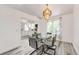 Inviting dining area with stylish furnishings, modern light fixture, and easy access to a well-appointed kitchen at 3679 S Zeno Way, Aurora, CO 80013