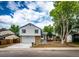Charming two-story home with a well-maintained lawn, mature tree, and inviting curb appeal at 3679 S Zeno Way, Aurora, CO 80013