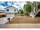 Charming home with a well-manicured lawn, long driveway, and inviting curb appeal on a partly cloudy day at 3679 S Zeno Way, Aurora, CO 80013