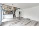 Spacious living room featuring modern floors, staircase, and an open layout, perfect for entertaining at 3679 S Zeno Way, Aurora, CO 80013