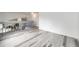 Versatile loft area with wood-look floors, neutral walls, and views of the downstairs, perfect for relaxation at 3679 S Zeno Way, Aurora, CO 80013