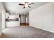 Bright living room showcases neutral carpet, recessed lighting, and open floor plan at 7326 Green River Ave, Frederick, CO 80530