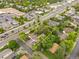 Captured from above, the property is outlined in yellow and near commercial spaces, road, trees, and parking at 5 S Wadsworth Blvd, Lakewood, CO 80226