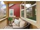 Relaxing front porch features a comfortable cushioned seat and potted plants, perfect for enjoying the outdoors at 14214 Waterside Ln, Broomfield, CO 80023