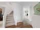 Spacious hallway with staircase leads to the living area, providing a seamless transition between floors at 14214 Waterside Ln, Broomfield, CO 80023