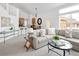 Bright open-concept living room with modern decor and large windows, perfect for entertaining or relaxing at 14214 Waterside Ln, Broomfield, CO 80023