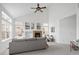 Bright living room features a vaulted ceiling, fireplace, large window and contemporary decor at 14214 Waterside Ln, Broomfield, CO 80023