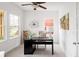 Bright and airy home office with ample natural light, a modern desk, and neutral decor at 14214 Waterside Ln, Broomfield, CO 80023