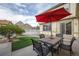 Outdoor patio area with table and chairs and artificial grass for low maintenance at 8645 Coors St, Arvada, CO 80005