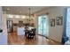 Open-concept kitchen and dining area with modern lighting and stainless steel appliances at 8645 Coors St, Arvada, CO 80005