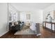 Modern living room with dark hardwood floors and neutral decor at 1166 Kearney St, Denver, CO 80220