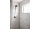 This bathroom has a handheld shower, as well as beautiful tile that gives this space a classic look at 2134 S Galapago, Denver, CO 80223