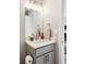 Chic powder room featuring a modern vanity with a quartz countertop, stylish faucet, and neutral decor at 2134 S Galapago, Denver, CO 80223