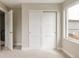 This bedroom boasts an open door frame, bright light and an organized closet space at 2134 S Galapago, Denver, CO 80223