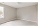 Neutral bedroom with a large window allowing for lots of natural light and carpeted floor at 2134 S Galapago, Denver, CO 80223