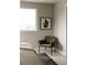 This is a chair sitting next to the bed in a bedroom with modern decor and good lighting at 2134 S Galapago, Denver, CO 80223