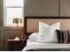 This is a detailed shot of a bedside table and bed in this elegant primary bedroom with great lighting at 2134 S Galapago, Denver, CO 80223