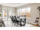 Bright dining area with large windows and a modern black dining table at 2134 S Galapago, Denver, CO 80223
