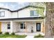 Inviting two-story home featuring a charming stone porch and contemporary design elements at 2134 S Galapago, Denver, CO 80223